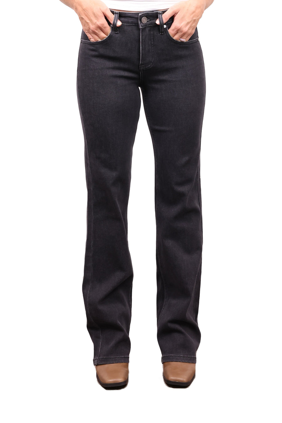 The Erica mid-rise bootcut tummy control jeans in charcoal, front view with boots