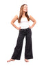 The Kim wide leg jeans in charcoal, hands on hips