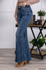 The Nicole from Judy Blue: Mid-Rise Tummy Control Vintage Wash Cut Hem Flare Denim