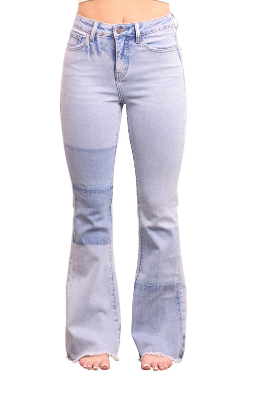 Light blue flared jeans on a white background