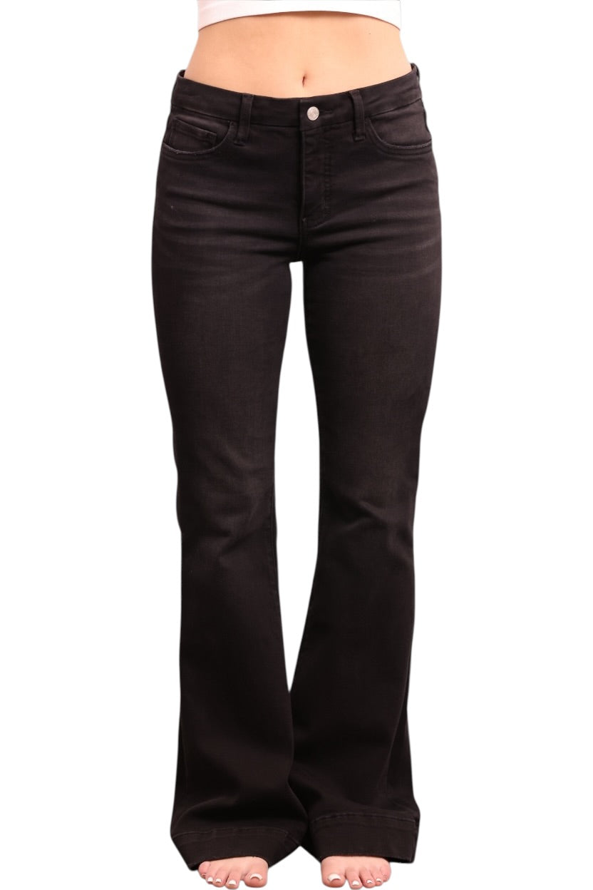 Black flared jeans on a white background