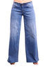 A pair of wide-leg blue denim jeans shown on a cropped model against a plain white background.