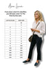 Woman standing next to a size chart for Ava Lane clothing, with a white background.