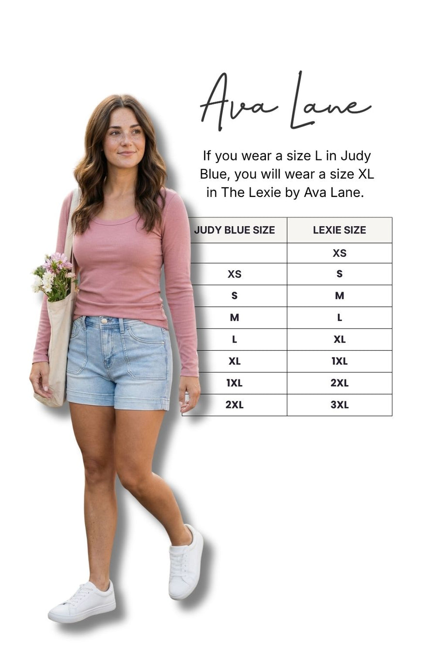 Woman wearing a pink top and light blue shorts with a size chart on a white background