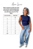 Woman wearing a navy top and light blue jeans with a size chart on a white background, featuring Ava Lane branding.