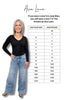 Woman wearing jeans with a size chart for Ava Lane clothing brand.
