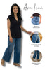 Woman wearing blue jeans with Ava Lane branding, highlighting features like high-rise, tummy control, back pockets, and side seam details.