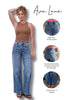 Woman wearing blue jeans with Ava Lane branding and product features highlighted.