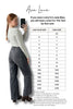 Person wearing gray pants with a size chart for Ava Lane clothing brand.