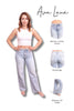 Woman wearing light blue jeans with product features highlighted on a white background