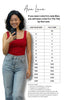 Woman in red tank top and blue jeans taking a selfie with a size chart for Ava Lane clothing brand.
