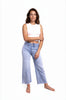 Ava Lane Boutique light wash cropped wide leg jeans with tummy control and raw hem. Model is wearing a white crop top.